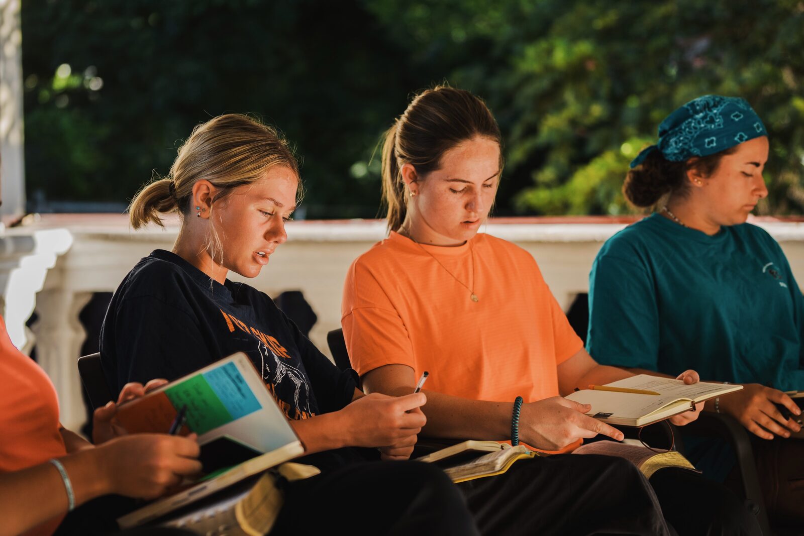 Builders studying together on a balcony